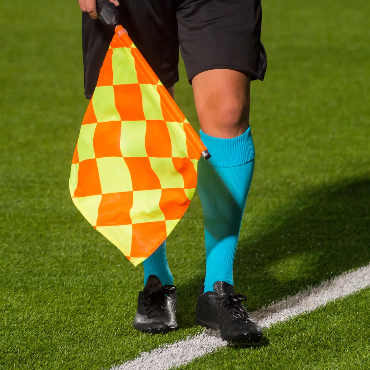 Linjedomarflagga vid sidlinjen